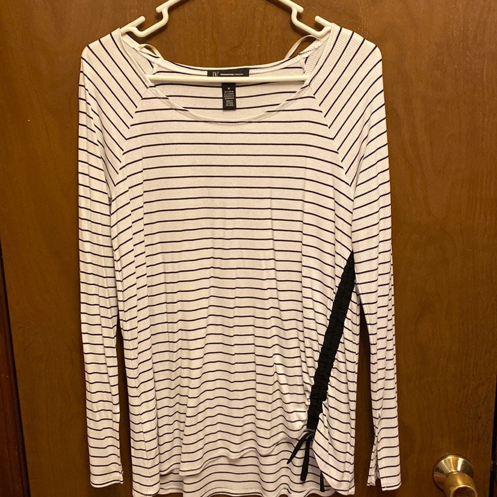 Woman’s black and white striped long sleeve top